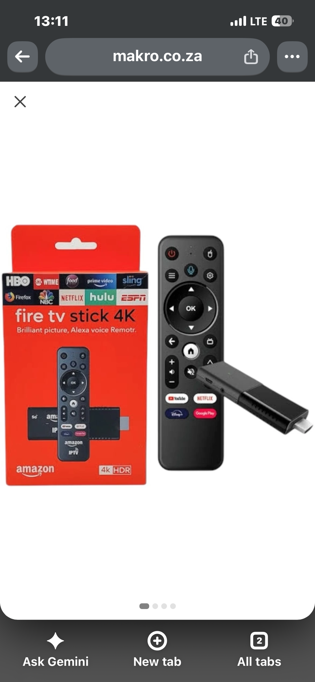 4K streaming TV stick with voice remote and retail packaging